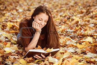 young female reading book