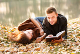 young man reading to his girlfriend