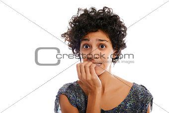 portrait of stressed woman biting fingernail