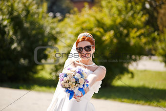 Happy bride outside.