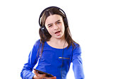 Smiling girl listening to music on digital tablet