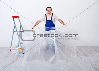 Worker preparing to paint a room