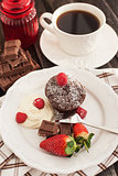 Chocolate muffin served with cream and fresh berris