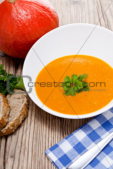 fresh tasty pumpkin soup and bread