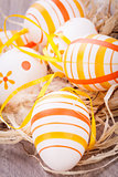 Decorative Easter eggs, on a rustic wooden table