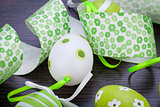 Colourful green Easter eggs in straw