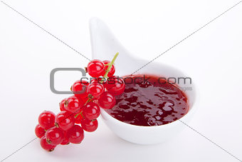 tasty fresh red currant jam isolated on white