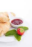 deliscios fresh croissant with strawberry jam isolated