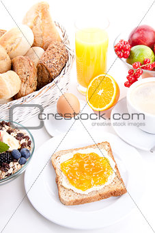 breakfast table with toast and orange marmelade isolated