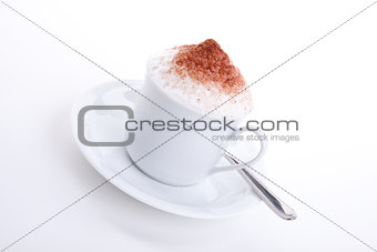 fresh capuccino with chocolate and milk foam isolated