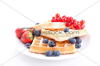 sweet fresh tasty waffles with mixed fruits isolated