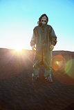 Man in protective suit and rays of sun