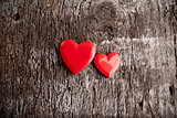 Love of red hearts on wooden background