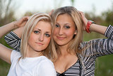 Closeup portrait of two attractive young women