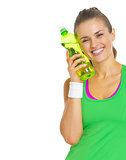 Smiling fitness young woman with bottle of water
