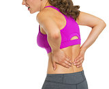 Closeup on young woman having back pain