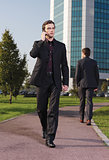 Businessman walking near office a