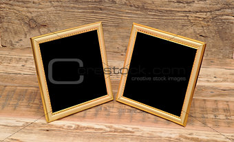 two blank photo frame on old table 