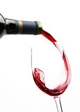 Red Wine Splashes into Stemmed Serving Glass