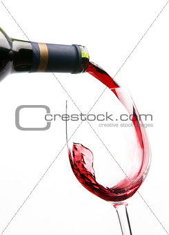 Red Wine Splashes into Stemmed Serving Glass