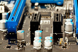 Condensators on laptop motherboard close view