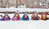 children on snow in winter time