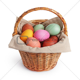 wicker basket full of pastel colors easter eggs