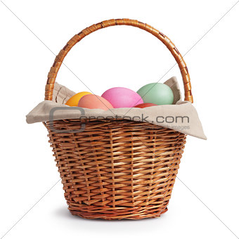 wicker basket full of pastel colors easter eggs