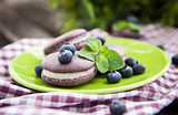 Violet french macarons with blueberry and mint