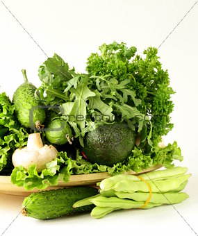 various green vegetables (avocado, green peas, cucumbers, parsley, lettuce)