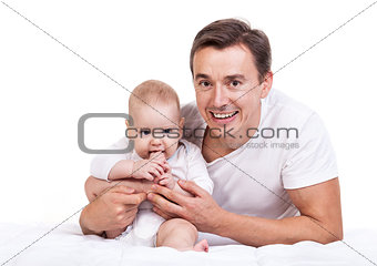 Young Caucasian father with baby son over white