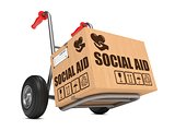 Social Aid - Cardboard Box on Hand Truck.