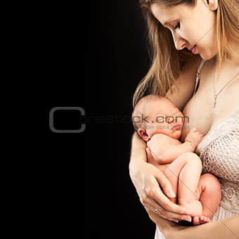 Young caucasian woman holding newborn son