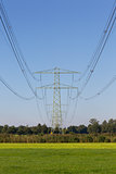 Electric powerlines across a beautiful field