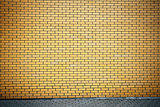 Vibrant yellow brick wall