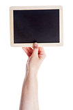 Hand holding blank blackboard 