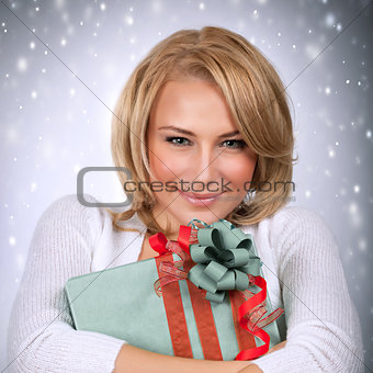Beautiful female with Christmas gift