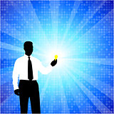 business man silhouette with light bulb