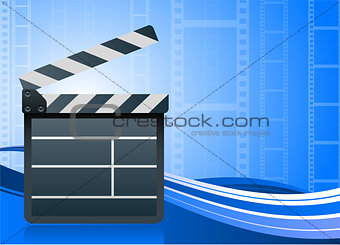 Film clapper board on blue background