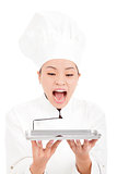 beautiful woman chef screaming and holding tray
