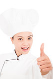 smiling female chef, cook or baker  showing thumbs up