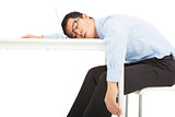Tired overworked businessman sleeps on desk
