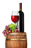 Grape and wine on a barrel