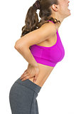 Closeup on young woman having back pain