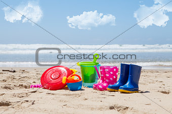 Colorful plastic children's toys on the beach