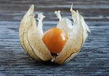 Physalis, lying on a wooden surface