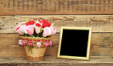 bouquet paper flower in a basket with blank photoframe