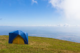 Tent on a grass under  blue sky