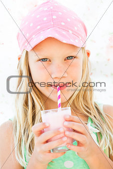 Young girl drinking smoothie