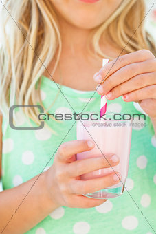 Smoothie drink held by young girl